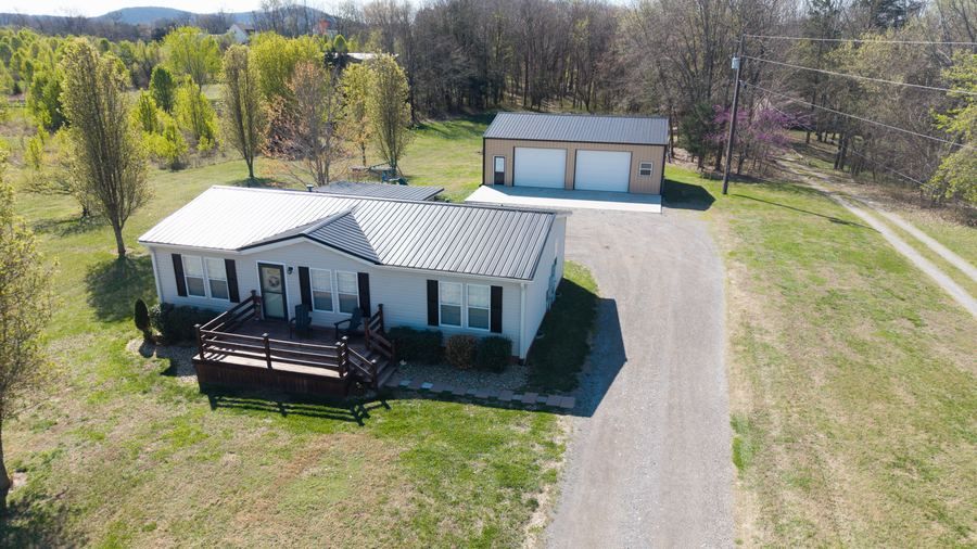 Aerial view of home with garage and deck