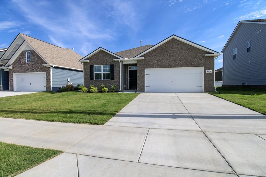 Single story brick home with garage